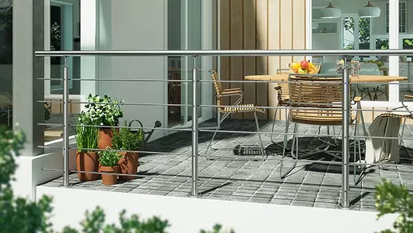 Harmony banister in stainless steel on balcony with patio furniture and plants